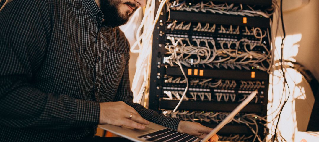 Young IT Service Man using Laptop