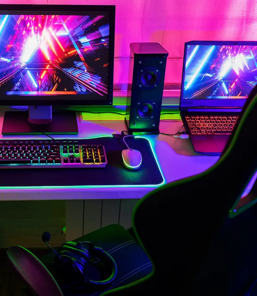WTC Communications Gananoque - Competitive online gamer desktop PC setup with tower, monitor, headphones and laptop.