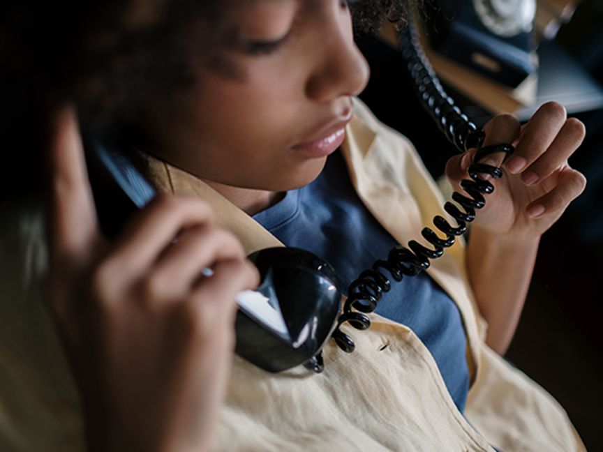 A child holding a telephone