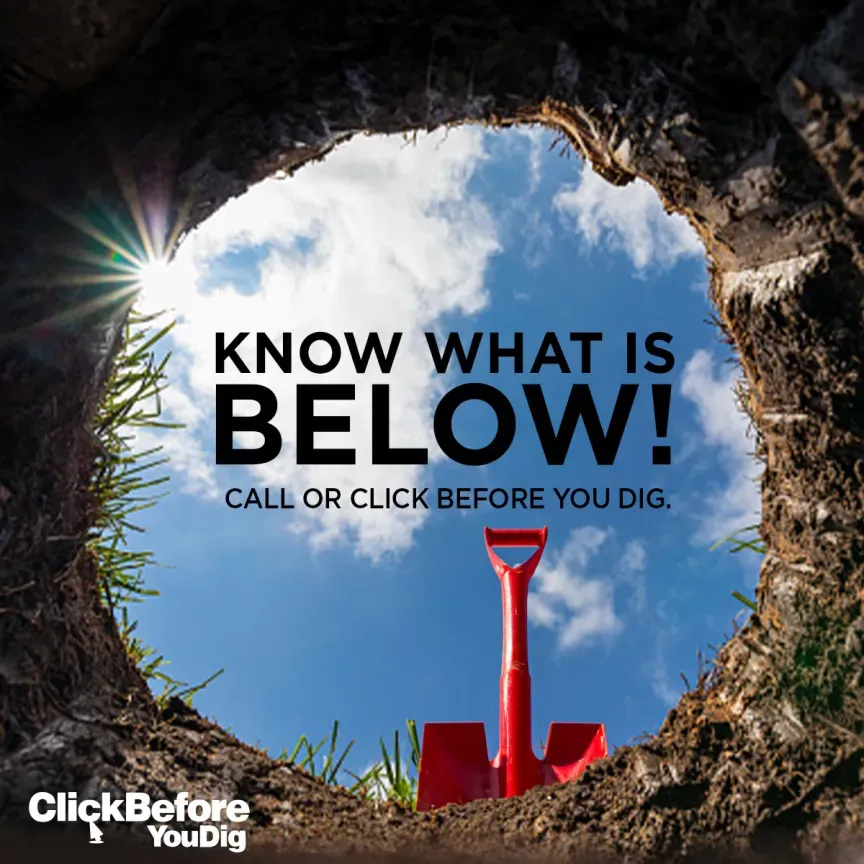 WTC Communications Ontario - View from inside a dug hole with a shovel directing to call before you dig to protect fibre optic cables in Ontario.